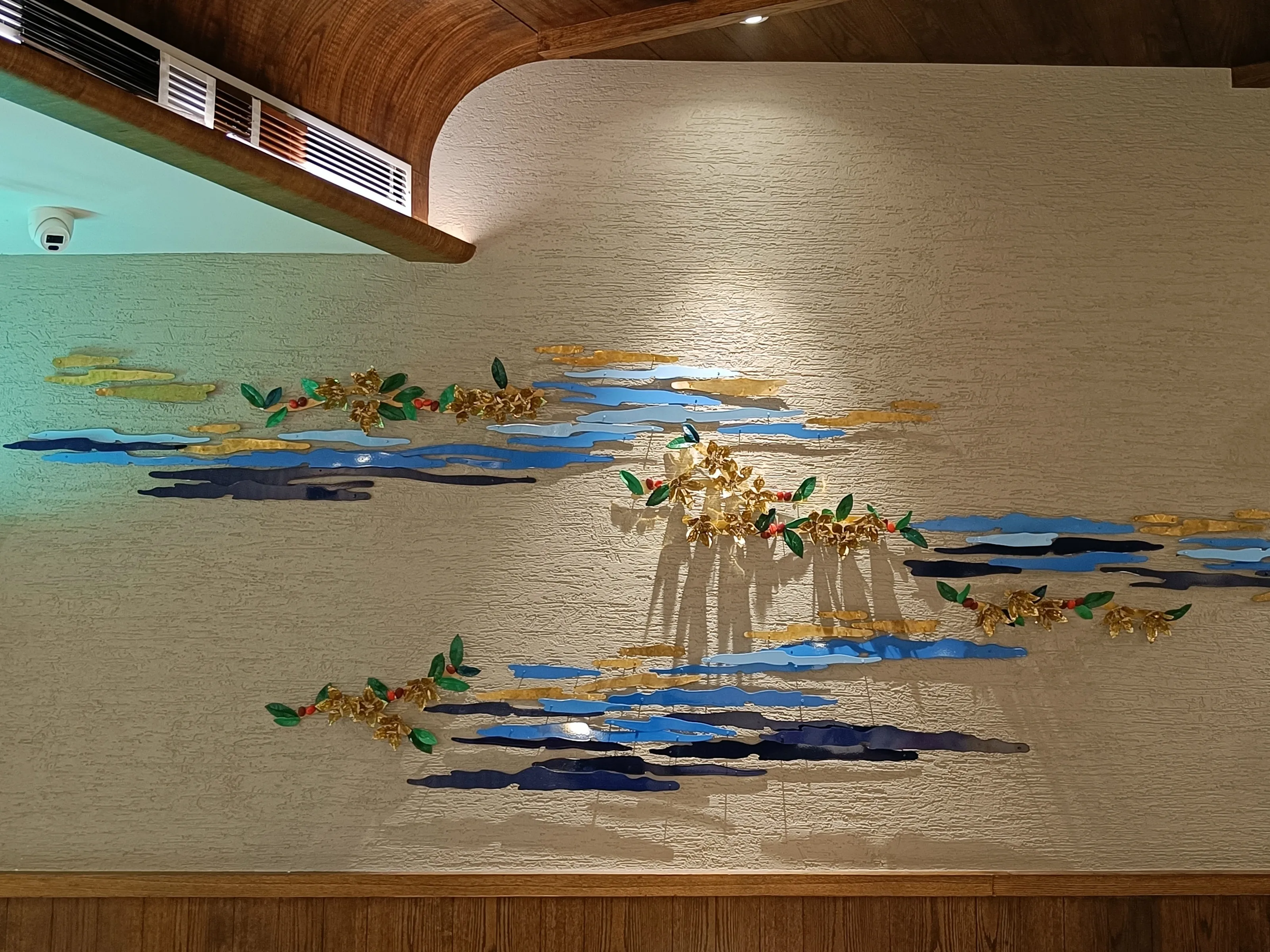 Bell-metal and clay installation at the Starbucks flagship, Brahmaputra riverfront